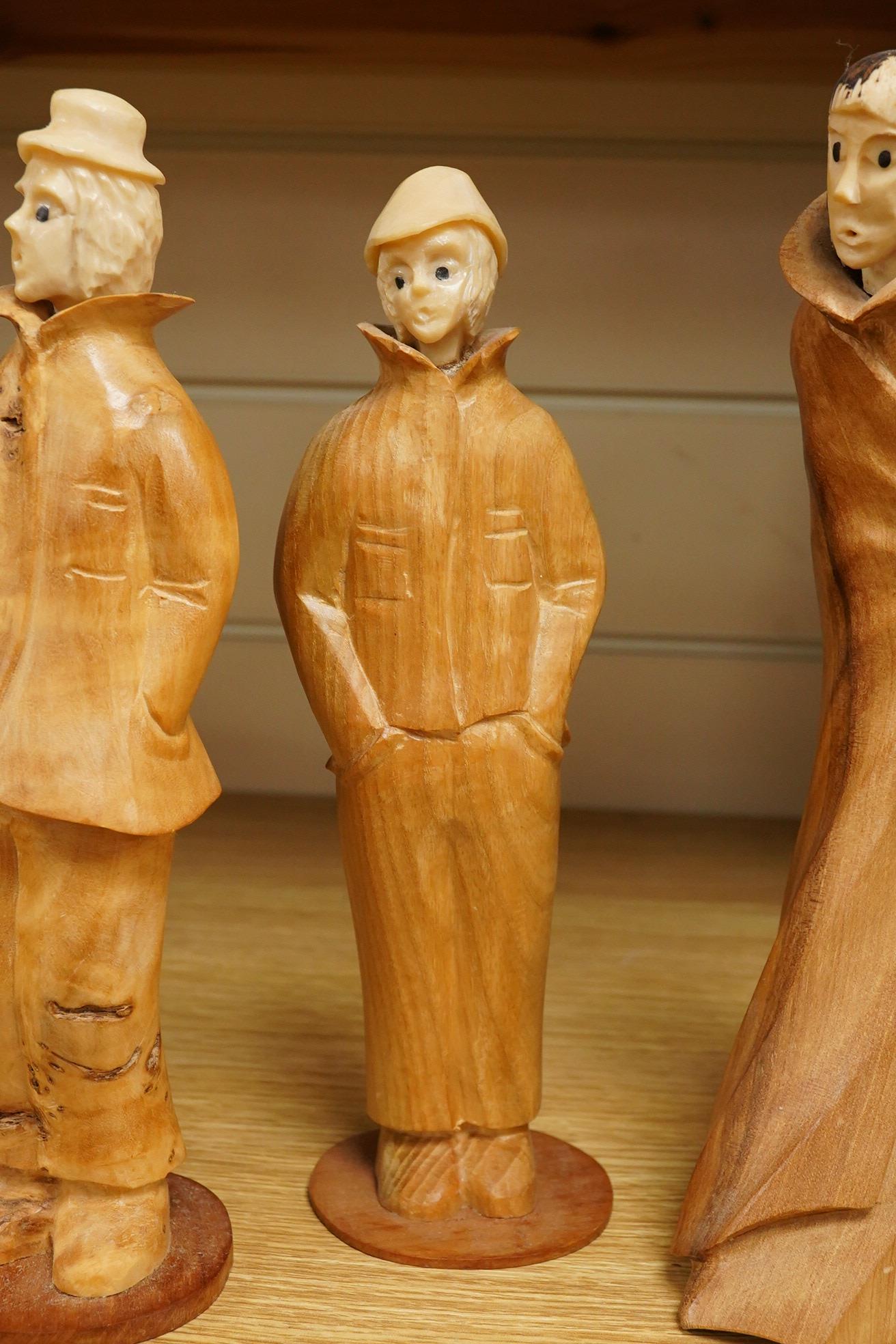 Pierre Decorse (b.1953), a group of four carved figures, tallest 29cm high